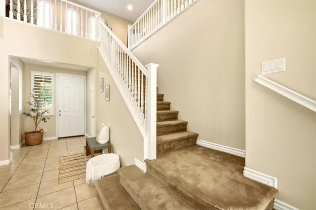 a view of entryway and dining room and stairs