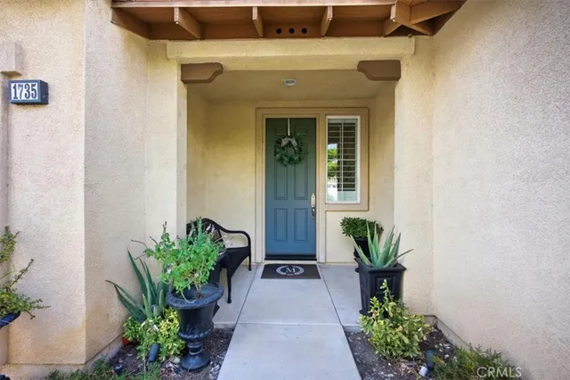 a view of a entryway with flower pots