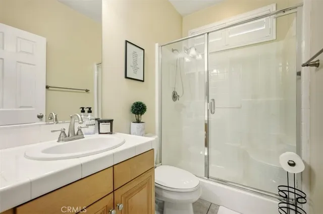 a view of a workspace with a window and cabinet