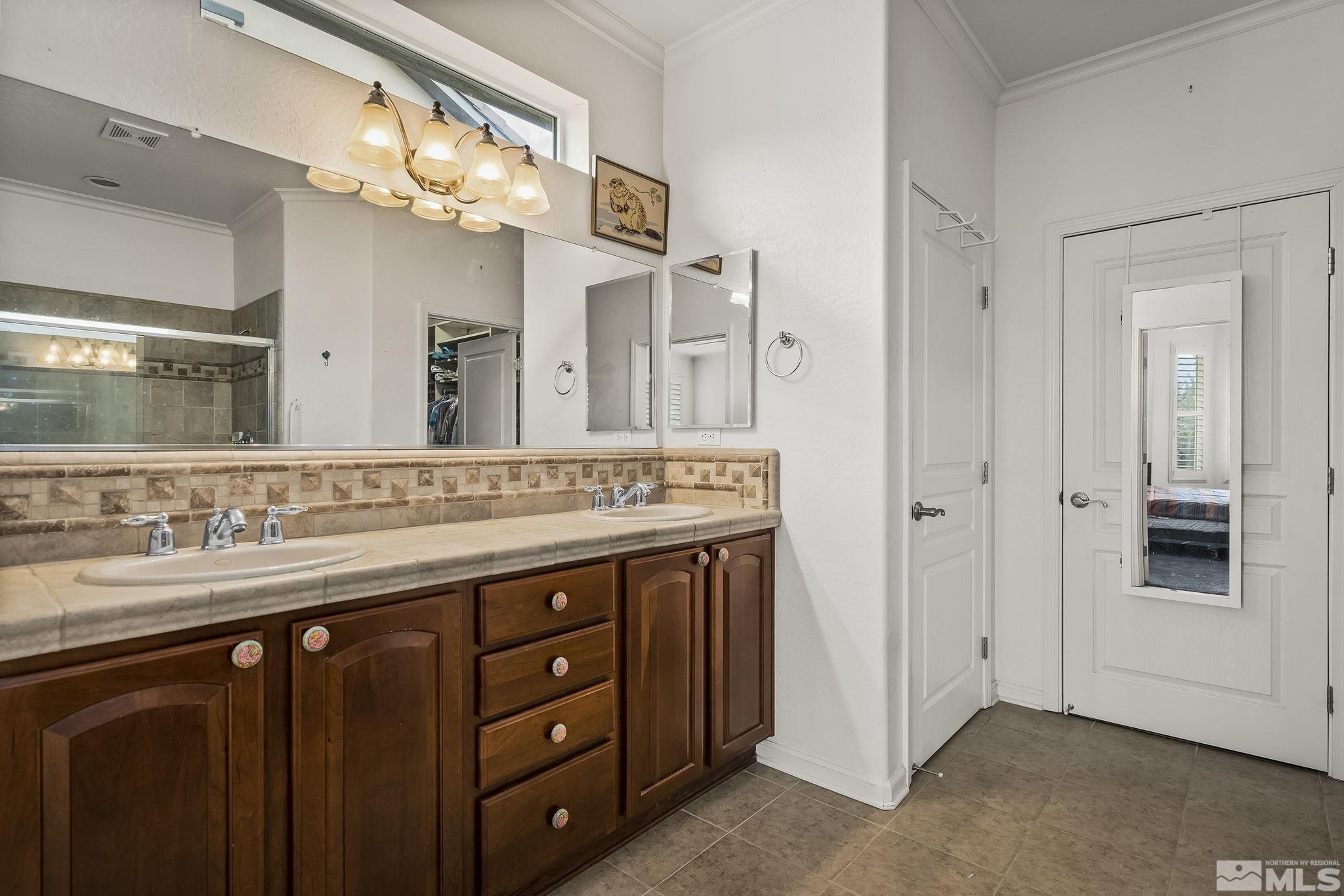 1355 Tarleton Way Reno, NV 89523 - Photo 13 of 40 a bathroom with a double vanity sink and a mirror