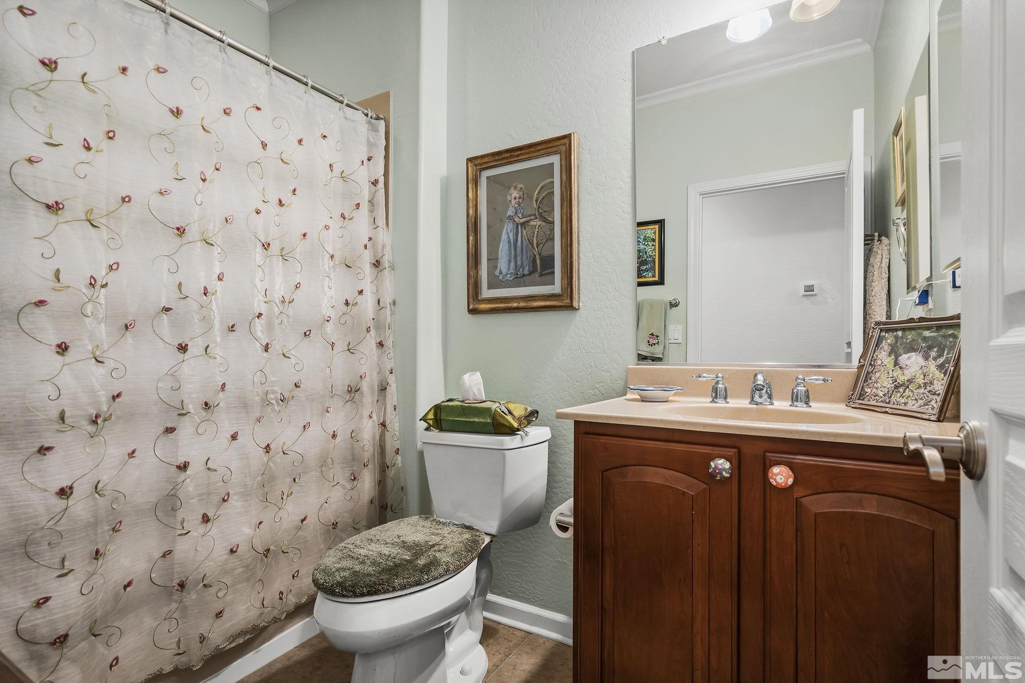 1355 Tarleton Way Reno, NV 89523 - Photo 15 of 40 a view of bathroom with a toilet sink and mirror