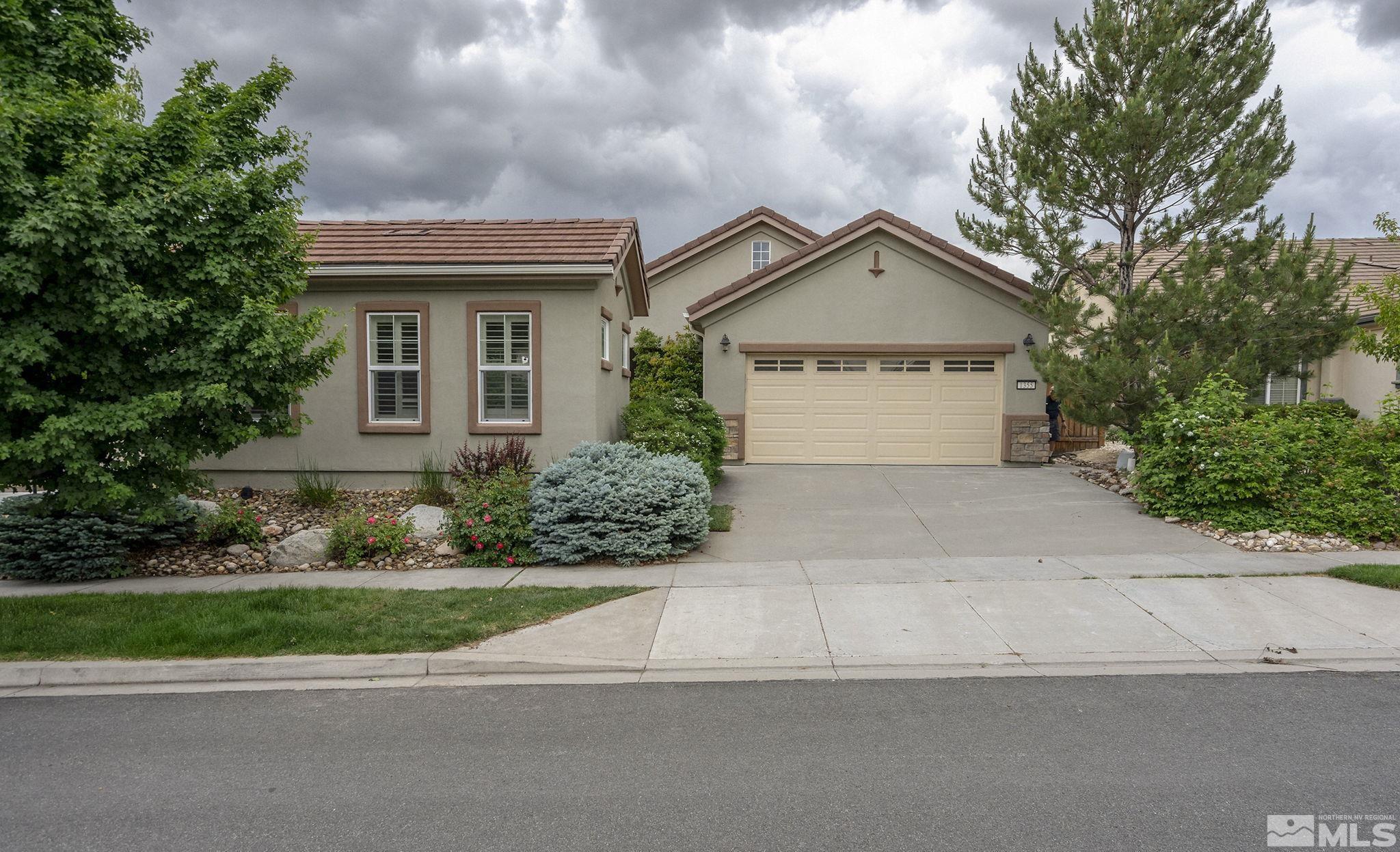 1355 Tarleton Way Reno, NV 89523 - Photo 2 of 40 a front view of a house with a yard and garage
