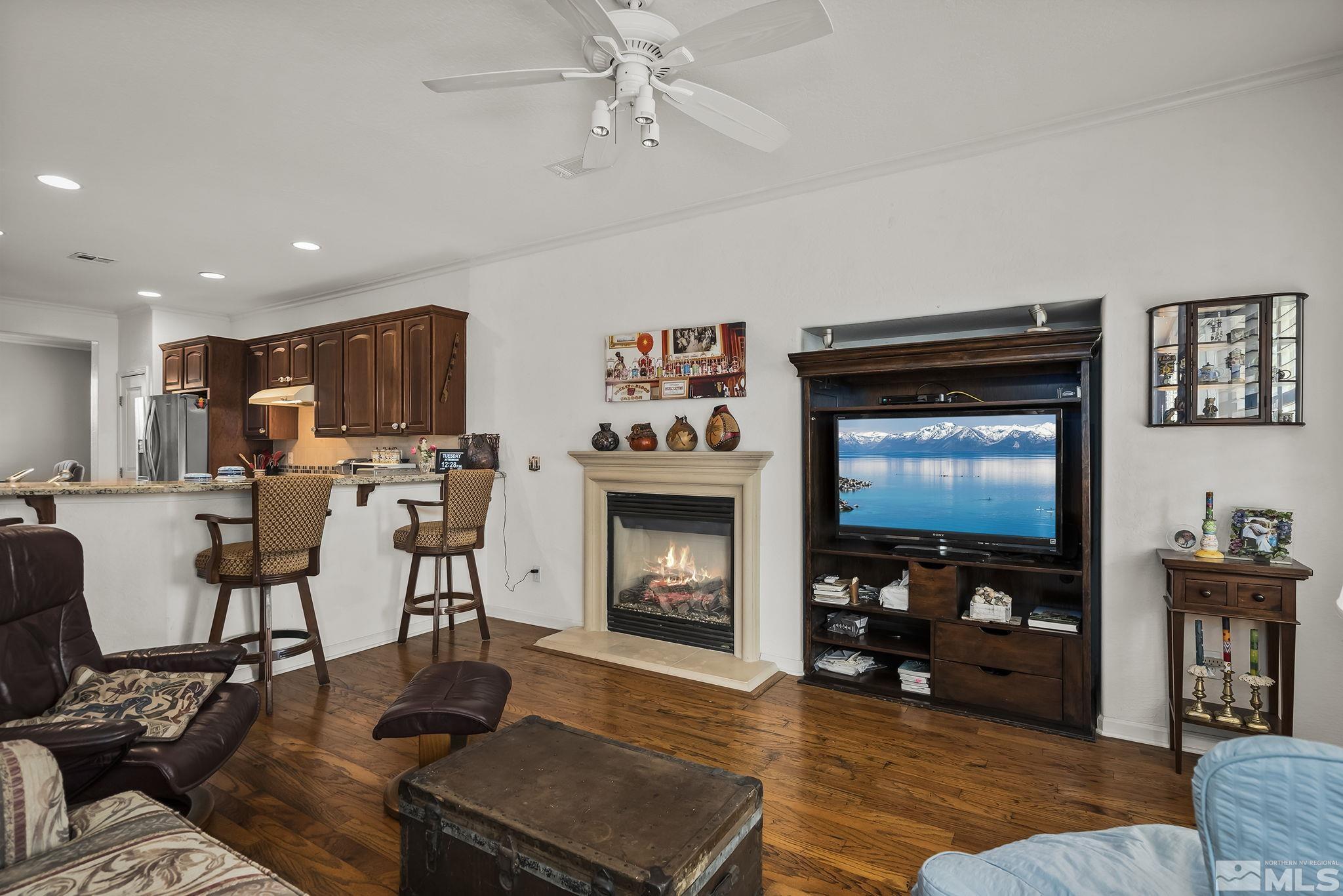 1355 Tarleton Way Reno, NV 89523 - Photo 7 of 40 a living room with furniture fireplace and flat screen tv