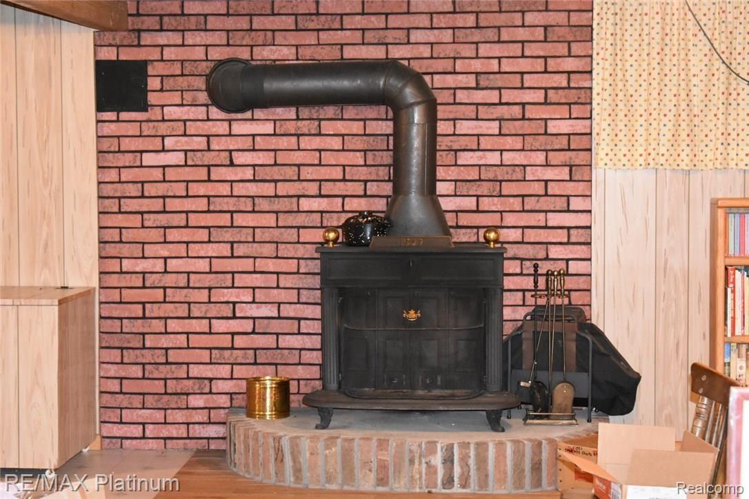 12711 Byron Road Byron, MI 48418 - Photo 20 of 24 Huge and open basement with woodburning stove