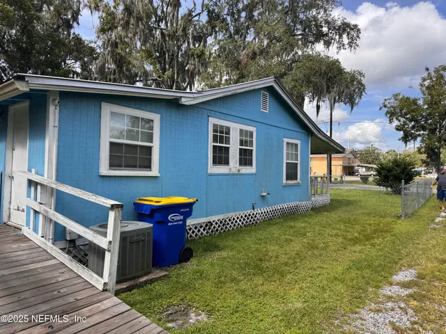 a house with trees in the background