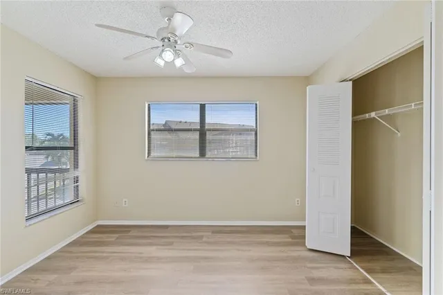 a view of a balcony with furniture