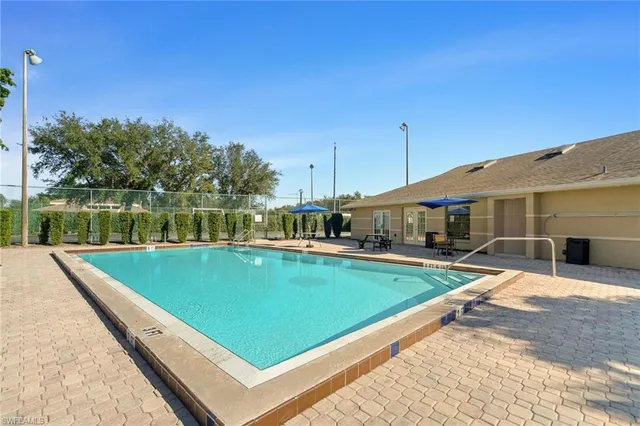 a view of a backyard with sitting area