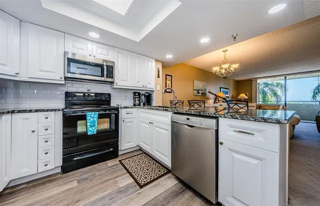 a kitchen with a sink and a refrigerator