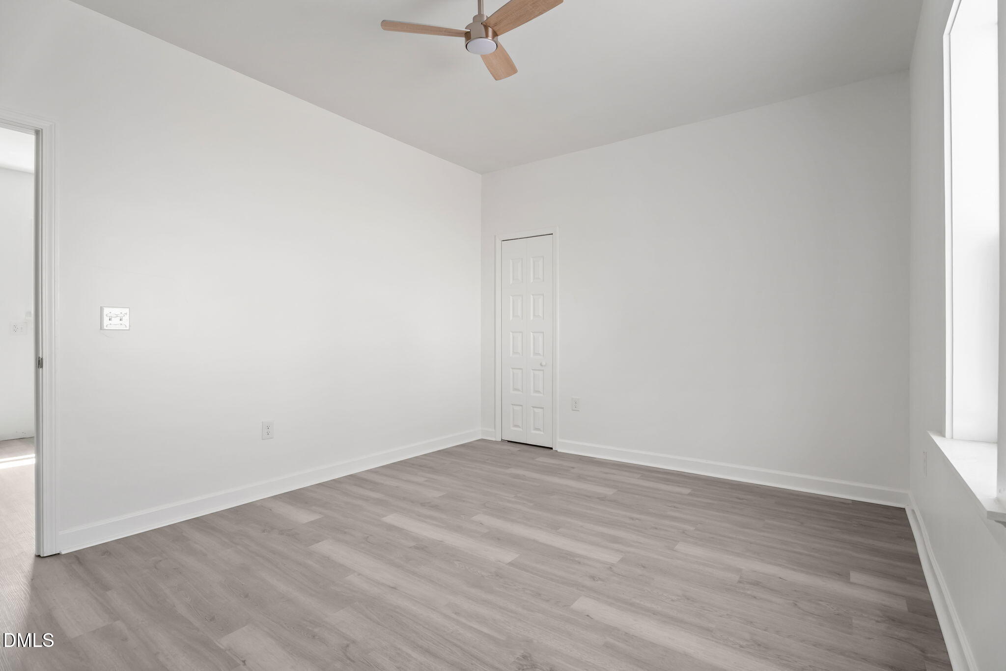 910 Gay Street Rocky Mount, NC 27804 - Photo 12 of 18 an empty room with wooden floor and windows