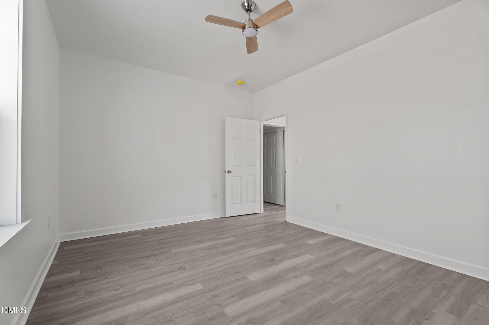 910 Gay Street Rocky Mount, NC 27804 - Photo 13 of 18 a view of a room with wooden floor and ceiling fan