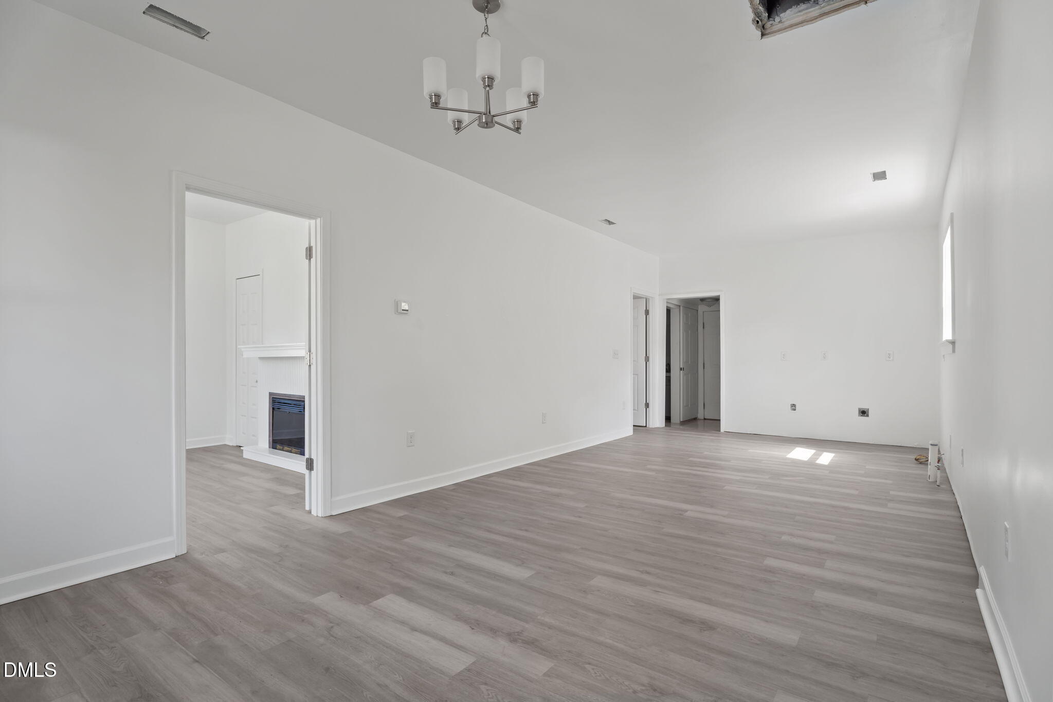 910 Gay Street Rocky Mount, NC 27804 - Photo 4 of 18 wooden floor in an empty room with a window