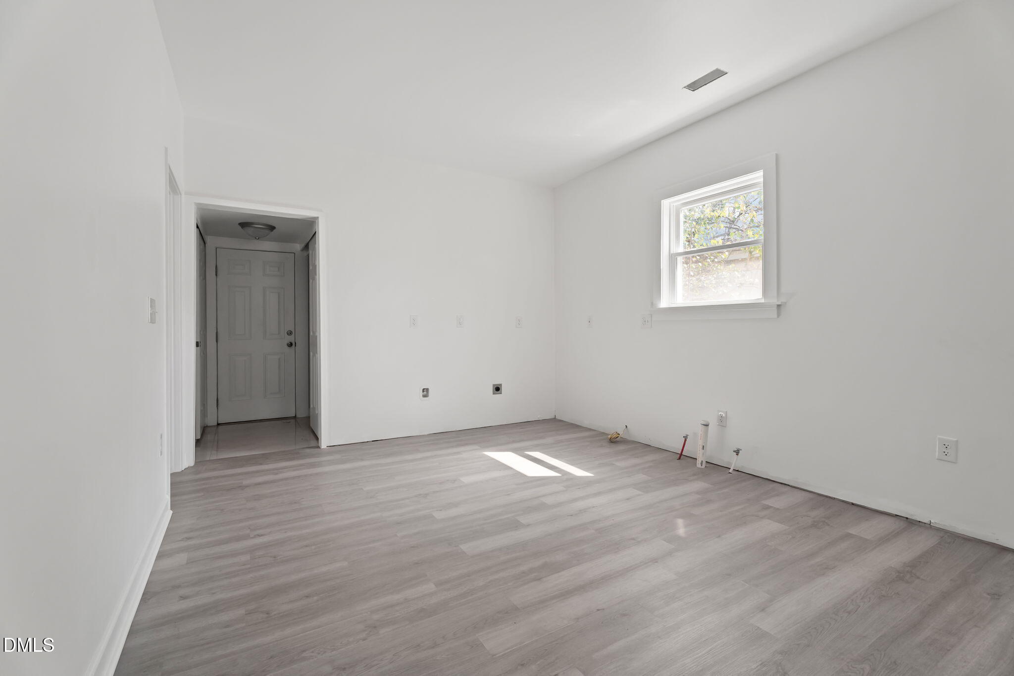 910 Gay Street Rocky Mount, NC 27804 - Photo 6 of 18 an empty room with wooden floor and windows