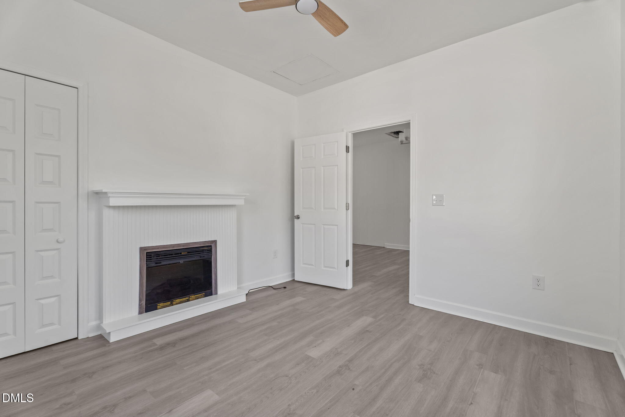 910 Gay Street Rocky Mount, NC 27804 - Photo 9 of 18 an empty room with wooden floor fireplace and windows
