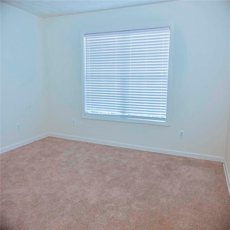 20 Hollow Court Covington, GA 30016 - Photo 15 of 29 an empty room with a window