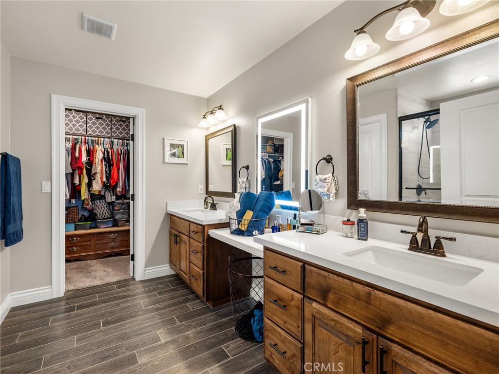 15620 Erie Road Apple Valley, CA 92307 - Photo 26 of 53 a bathroom with a sink double vanity and a mirror