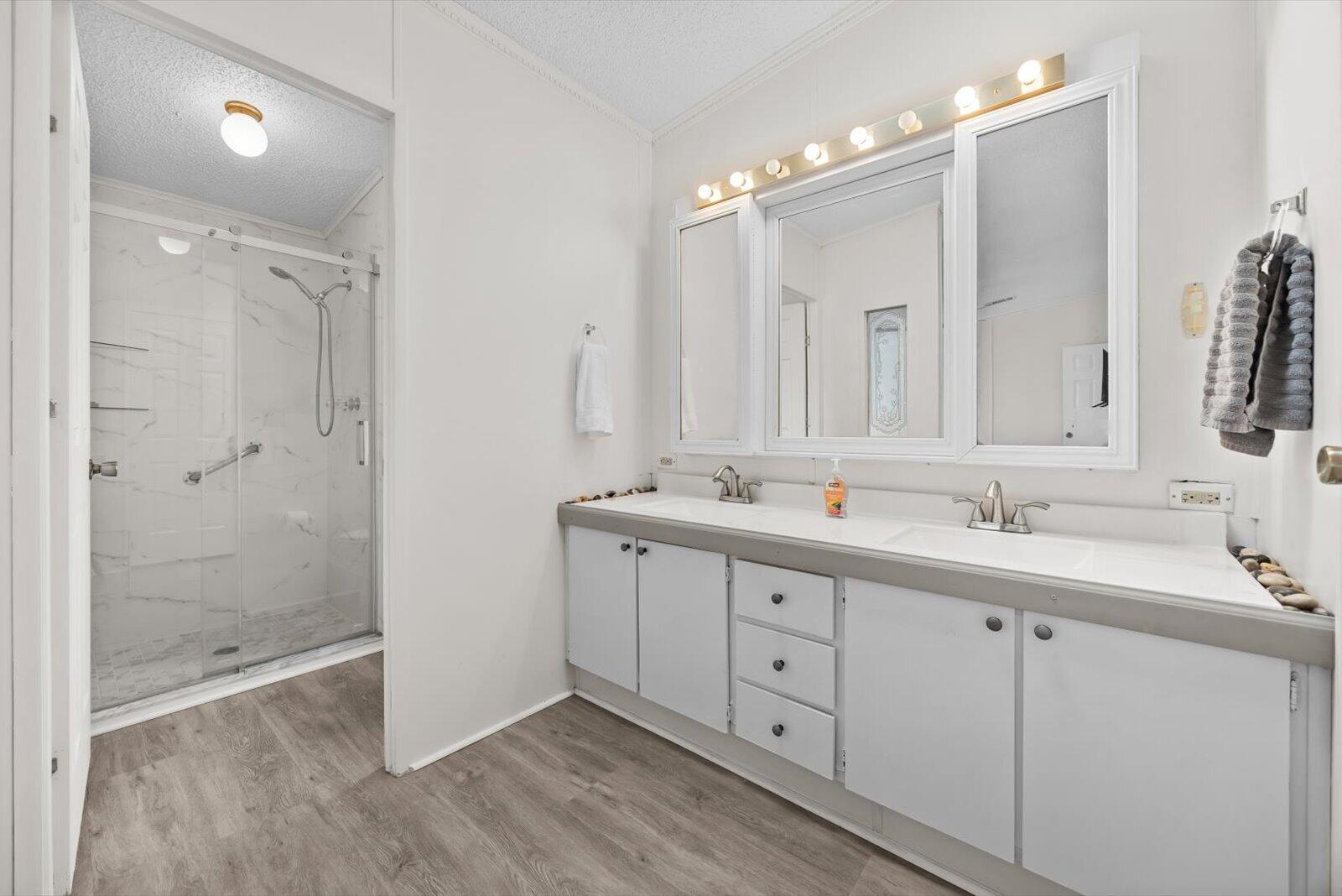 507 Tropical Isles Circle, Unit 25 Fort Pierce, FL 34982 - Photo 13 of 24 a bathroom with double sink and a mirror