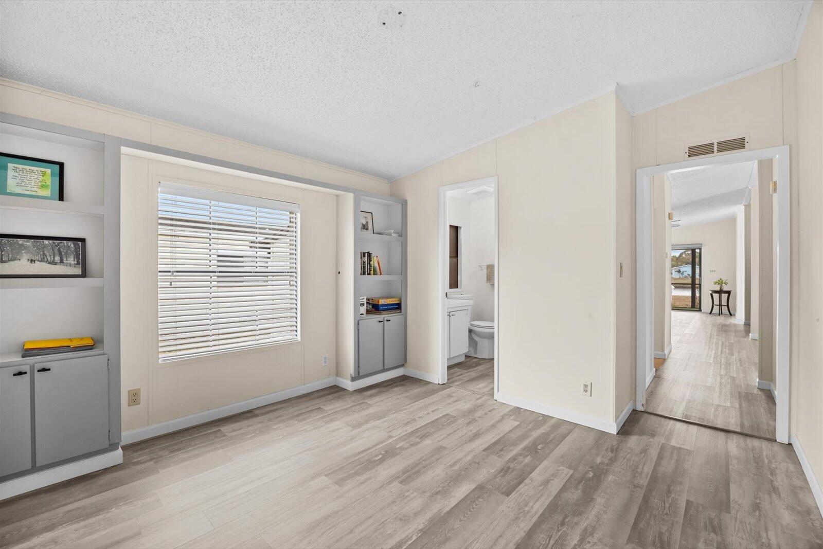 507 Tropical Isles Circle, Unit 25 Fort Pierce, FL 34982 - Photo 15 of 24 a view of a livingroom with wooden floor and a window