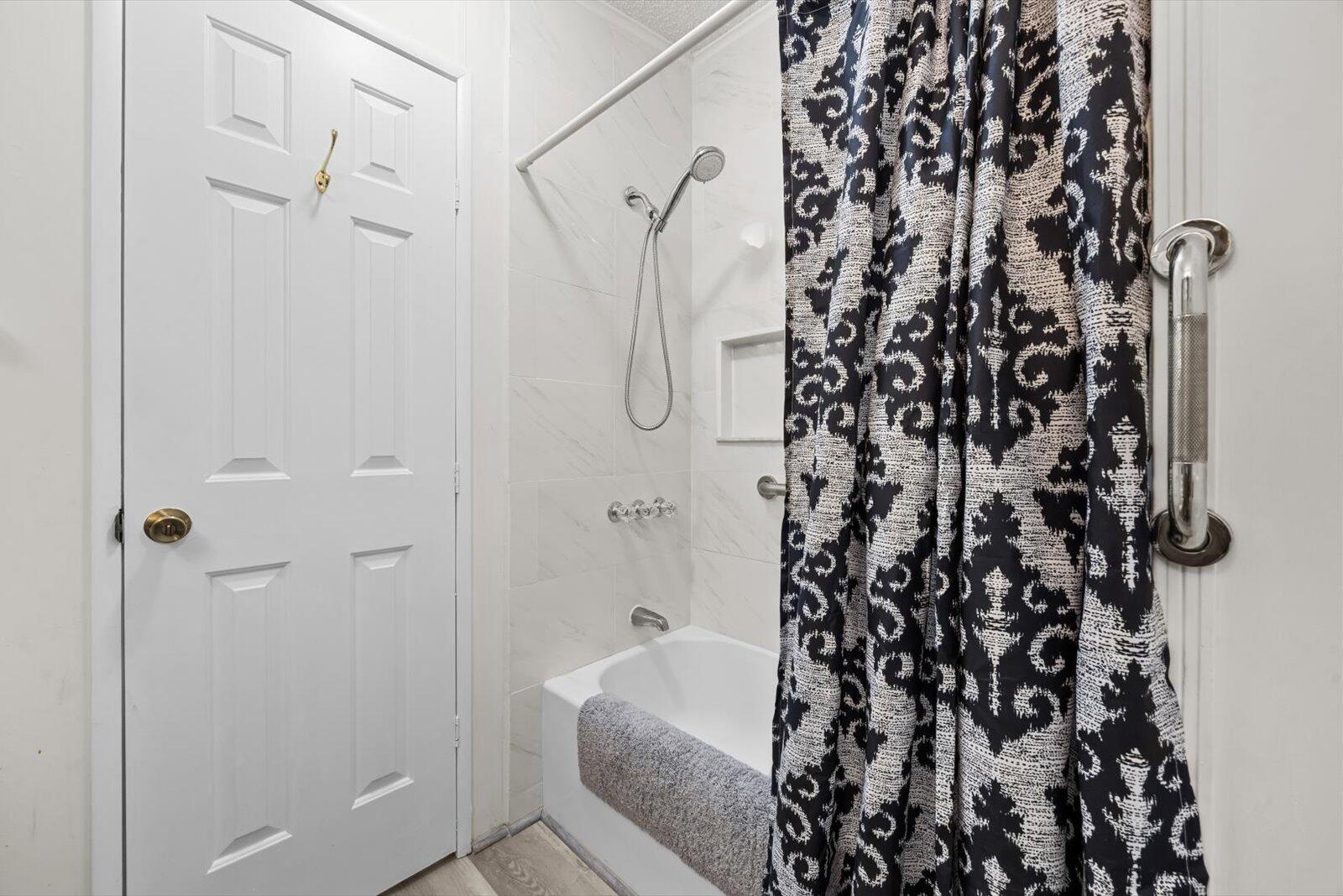 507 Tropical Isles Circle, Unit 25 Fort Pierce, FL 34982 - Photo 17 of 24 a bathroom with a bathtub and shower