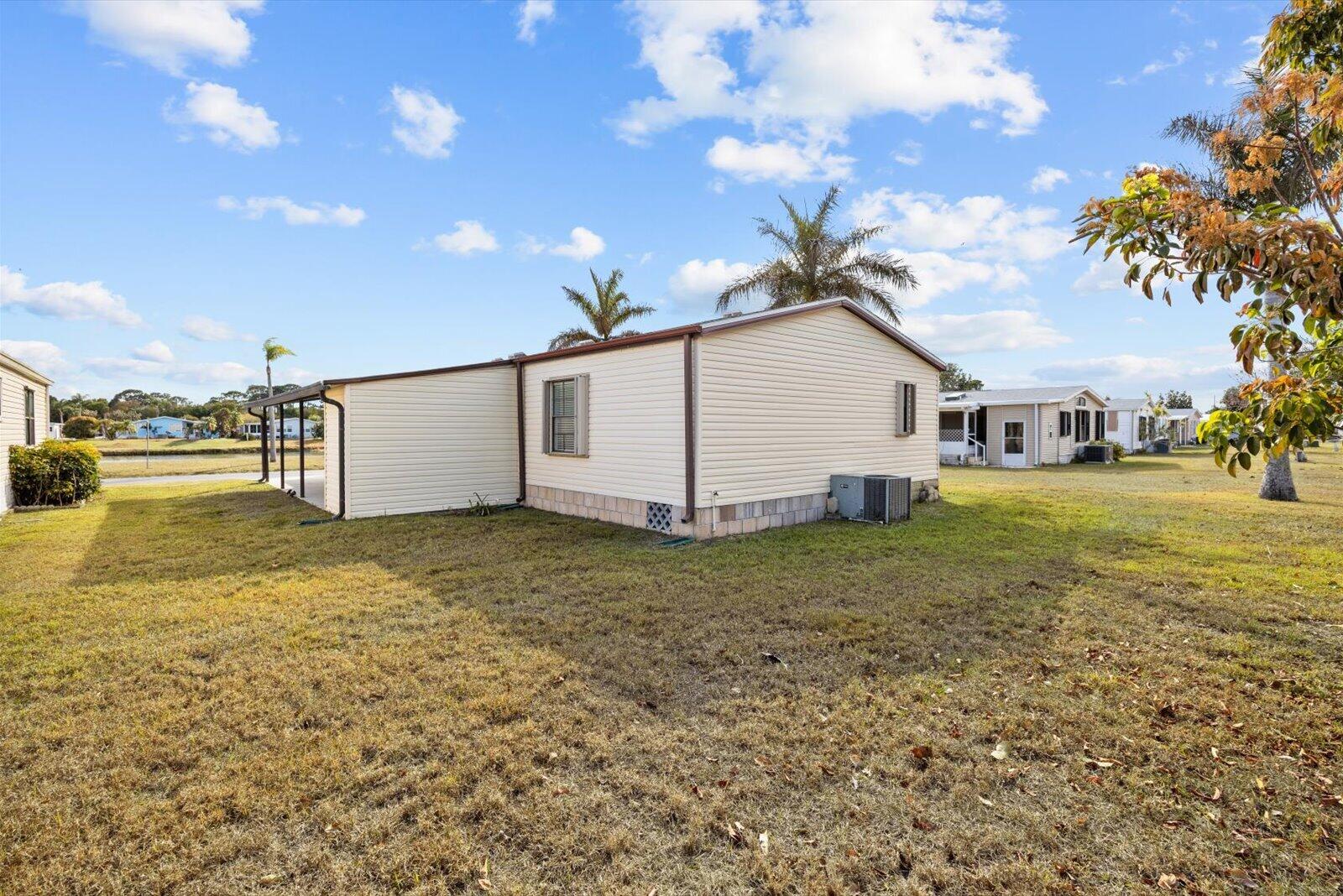 507 Tropical Isles Circle, Unit 25 Fort Pierce, FL 34982 - Photo 22 of 24 a house view with a garden space
