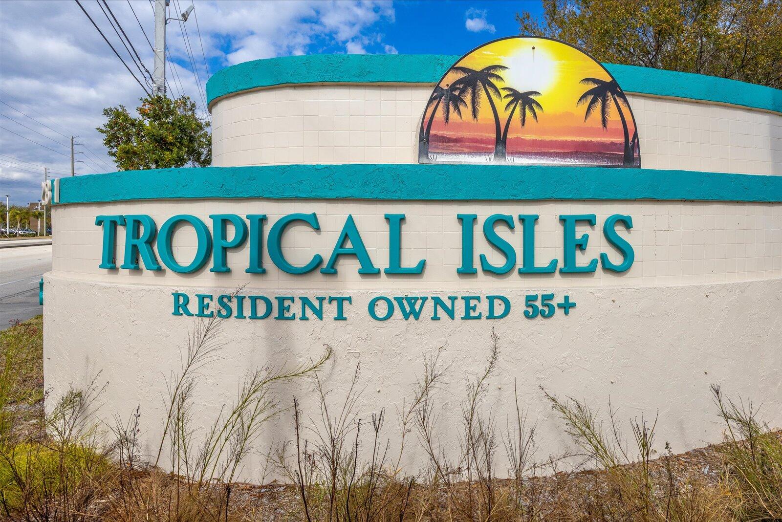 507 Tropical Isles Circle, Unit 25 Fort Pierce, FL 34982 - Photo 24 of 24 a street sign on a wall next to a building