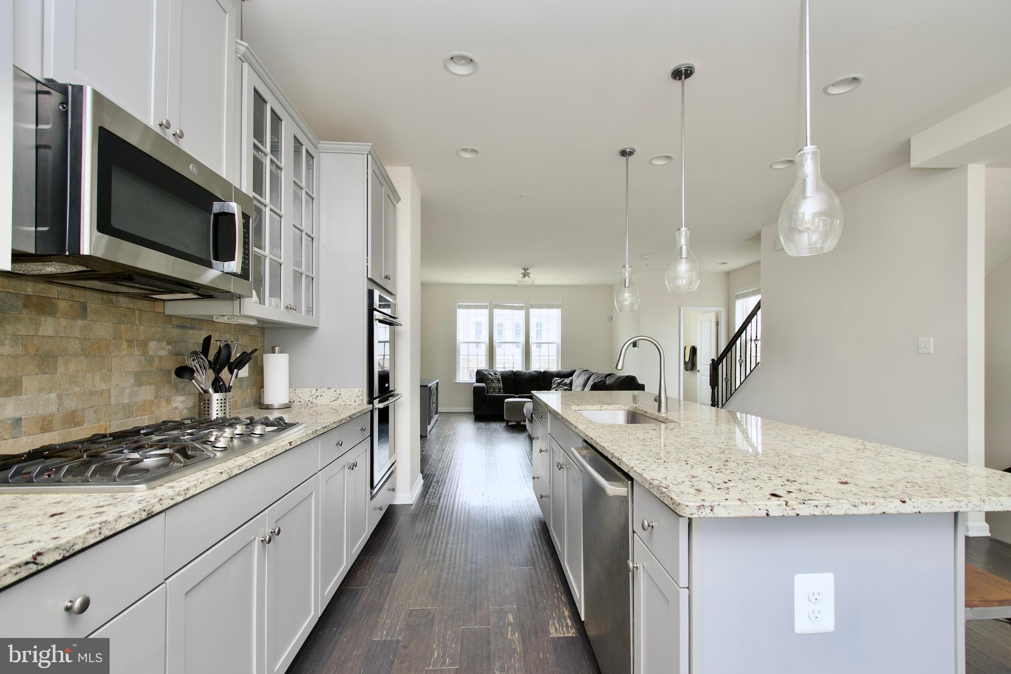 2900 Pinebrook Road Landover, MD 20785 - Photo 10 of 46 a kitchen with sink stove and cabinets
