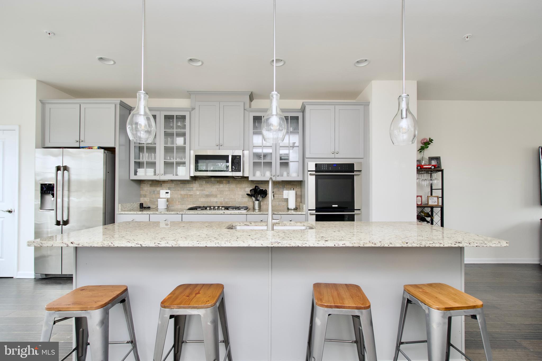 2900 Pinebrook Road Landover, MD 20785 - Photo 11 of 46 a kitchen with stainless steel appliances granite countertop a kitchen island a stove and a cabinets