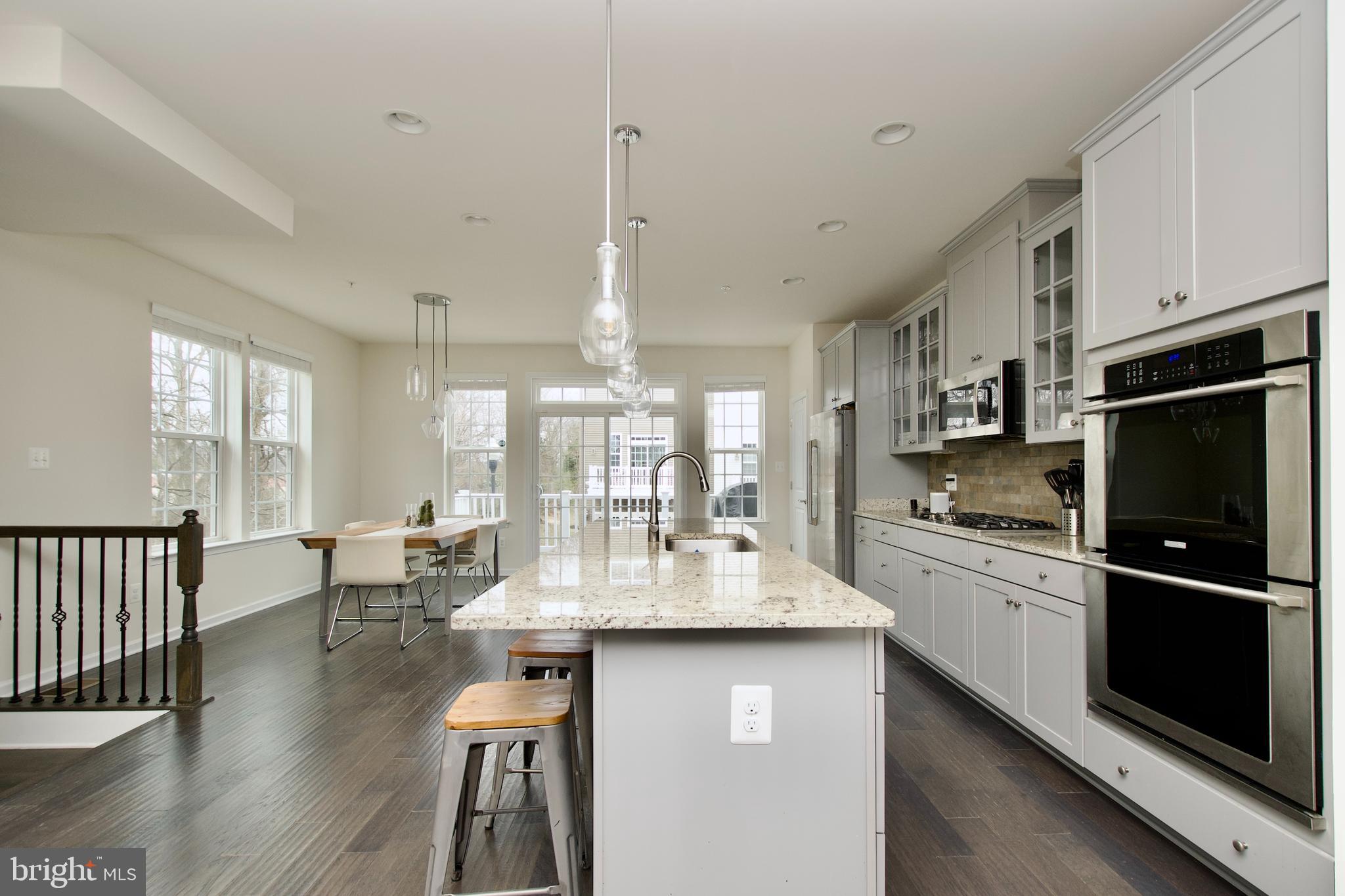 2900 Pinebrook Road Landover, MD 20785 - Photo 12 of 46 a kitchen with counter top space appliances and cabinets