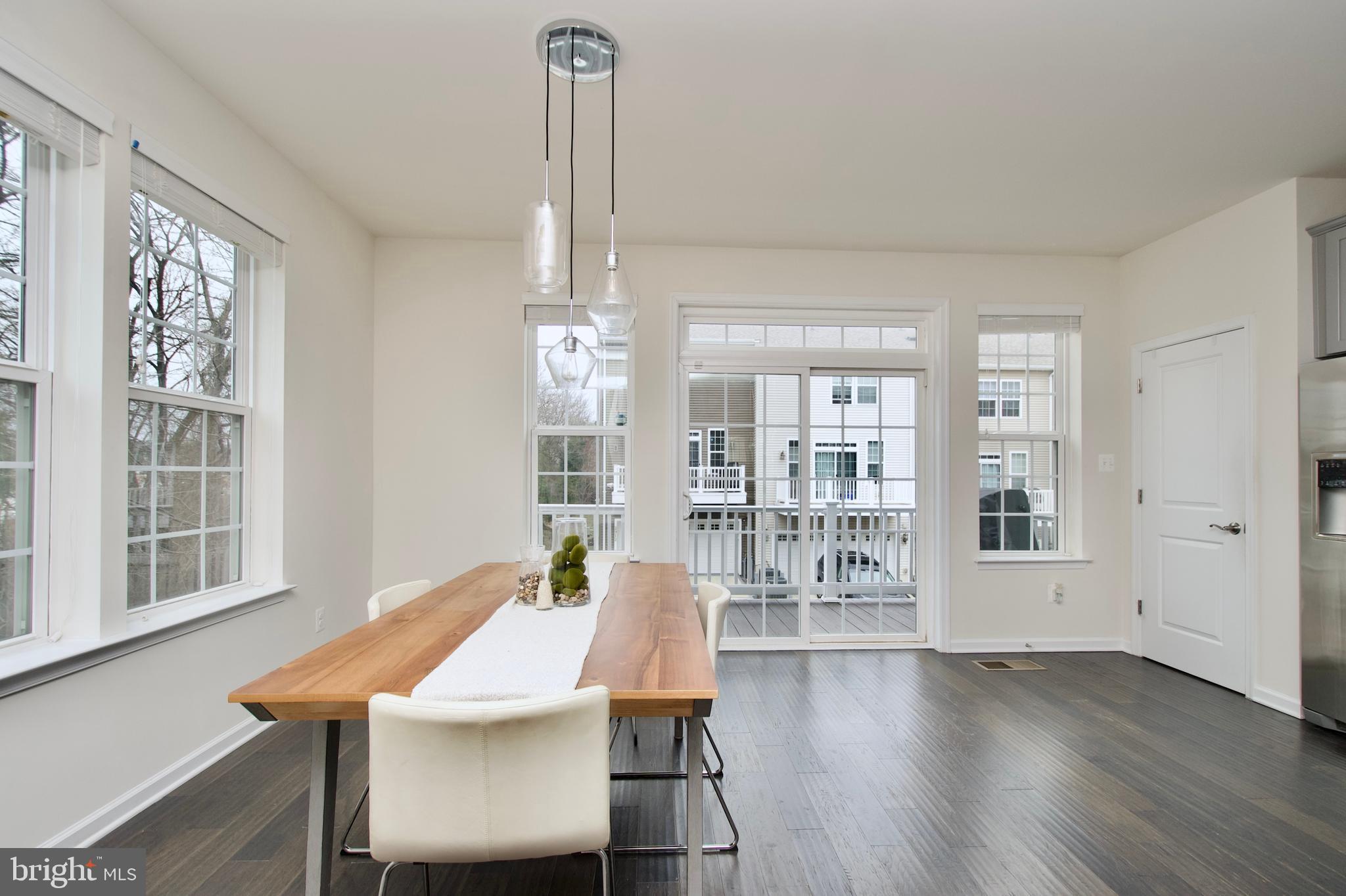 2900 Pinebrook Road Landover, MD 20785 - Photo 18 of 46 a view of a dining room with furniture window and wooden floor
