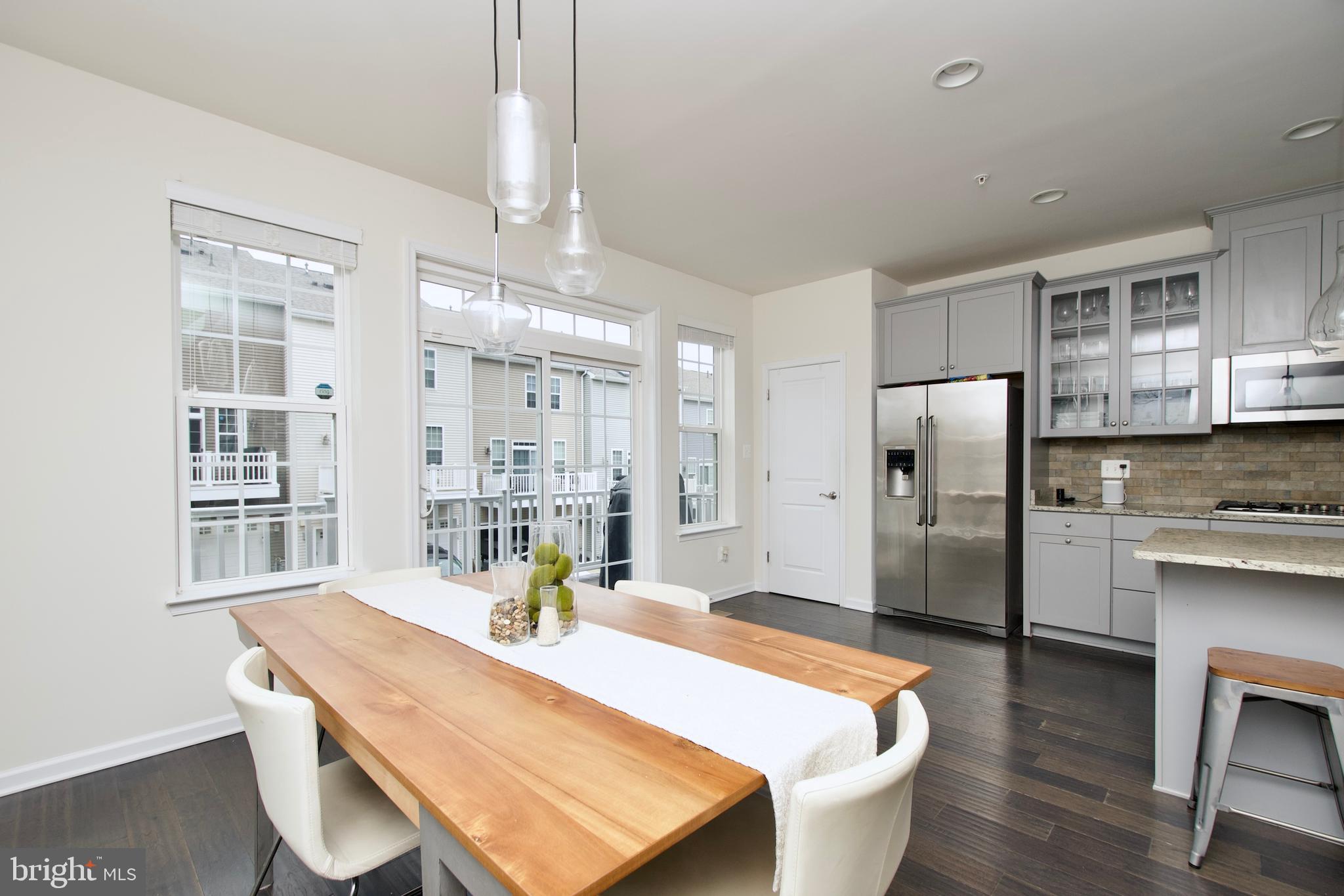 2900 Pinebrook Road Landover, MD 20785 - Photo 19 of 46 a kitchen with stainless steel appliances granite countertop a sink and a refrigerator
