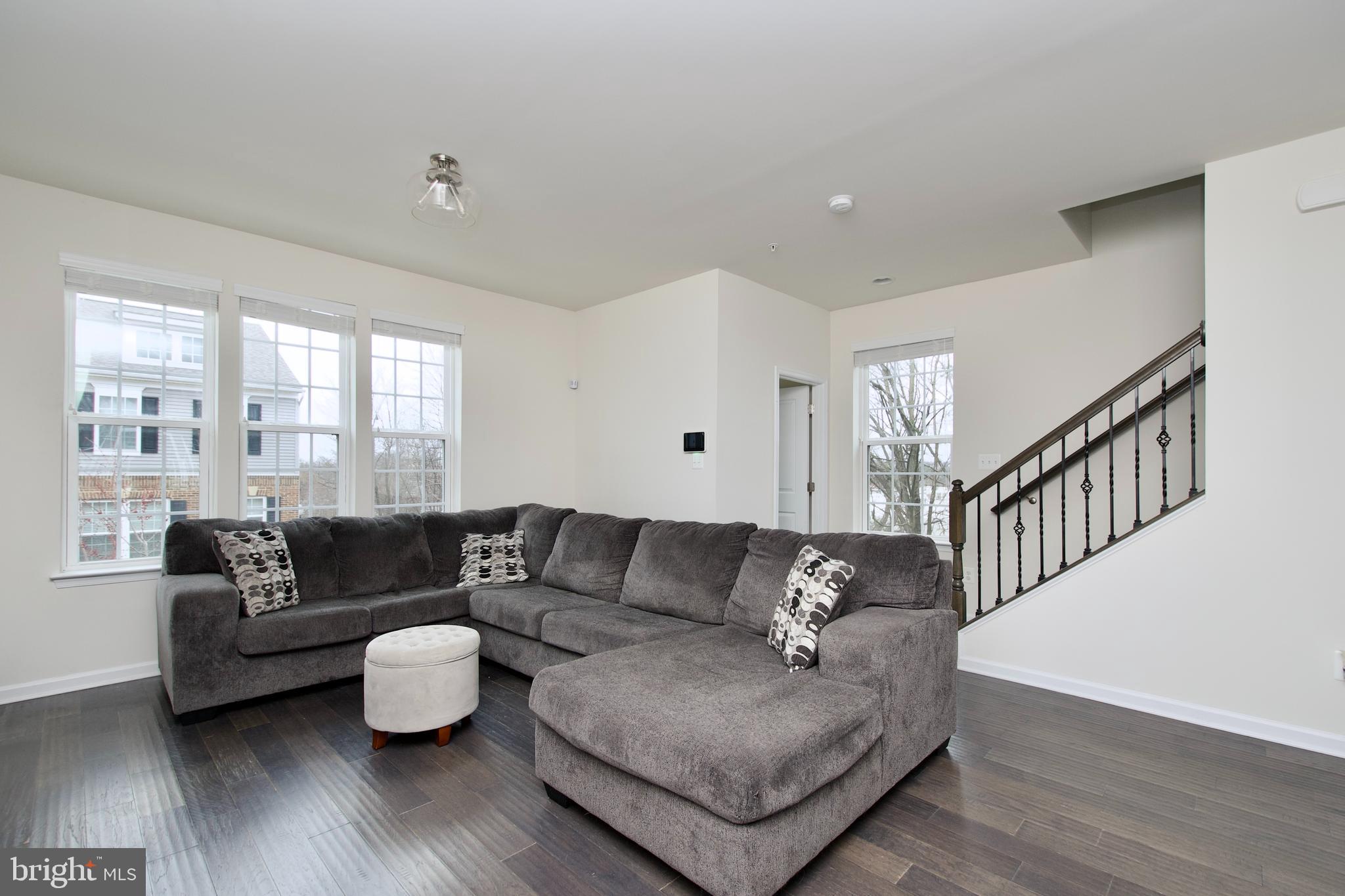 2900 Pinebrook Road Landover, MD 20785 - Photo 22 of 46 a living room with furniture and wooden floor