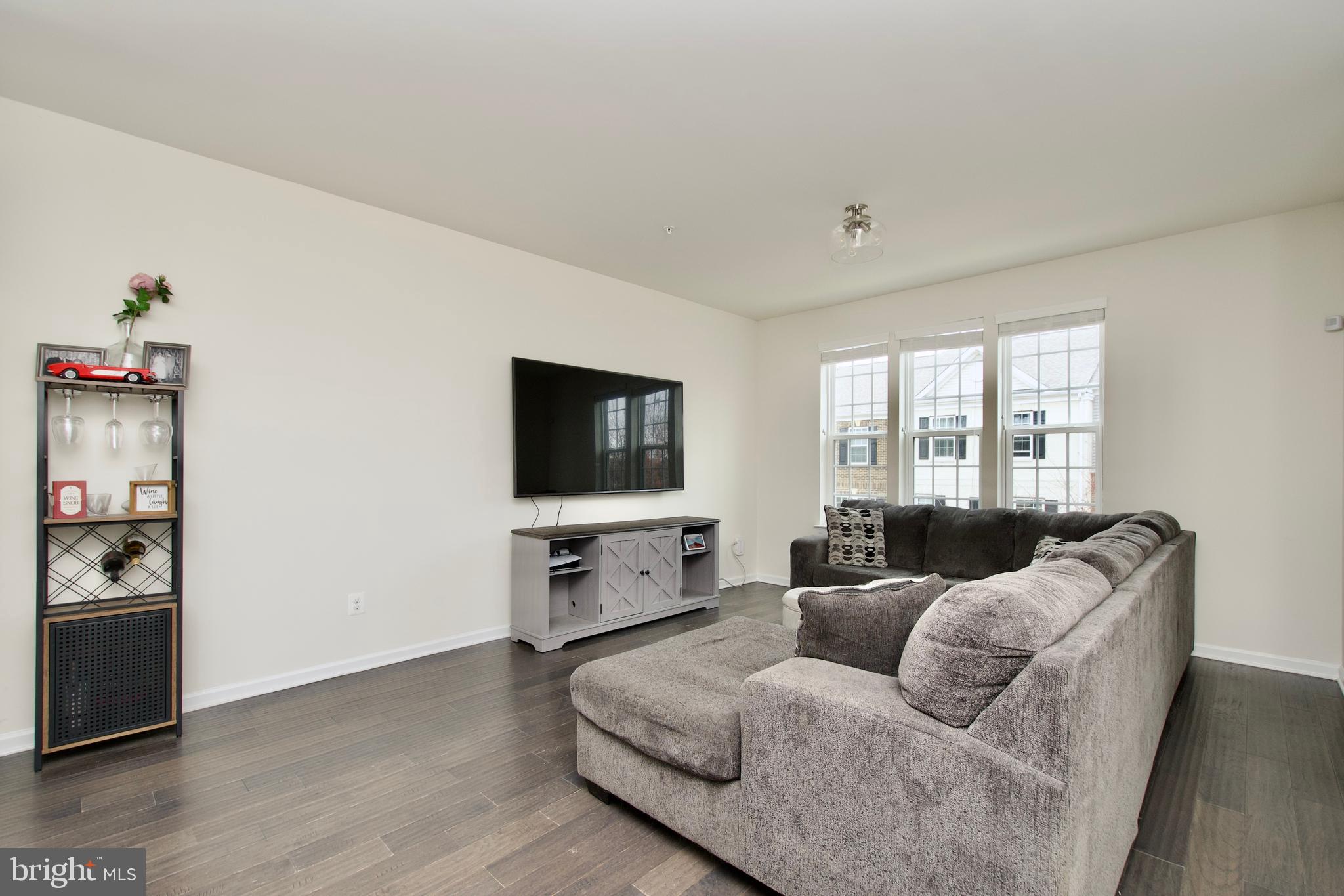 2900 Pinebrook Road Landover, MD 20785 - Photo 23 of 46 a living room with furniture and a flat screen tv