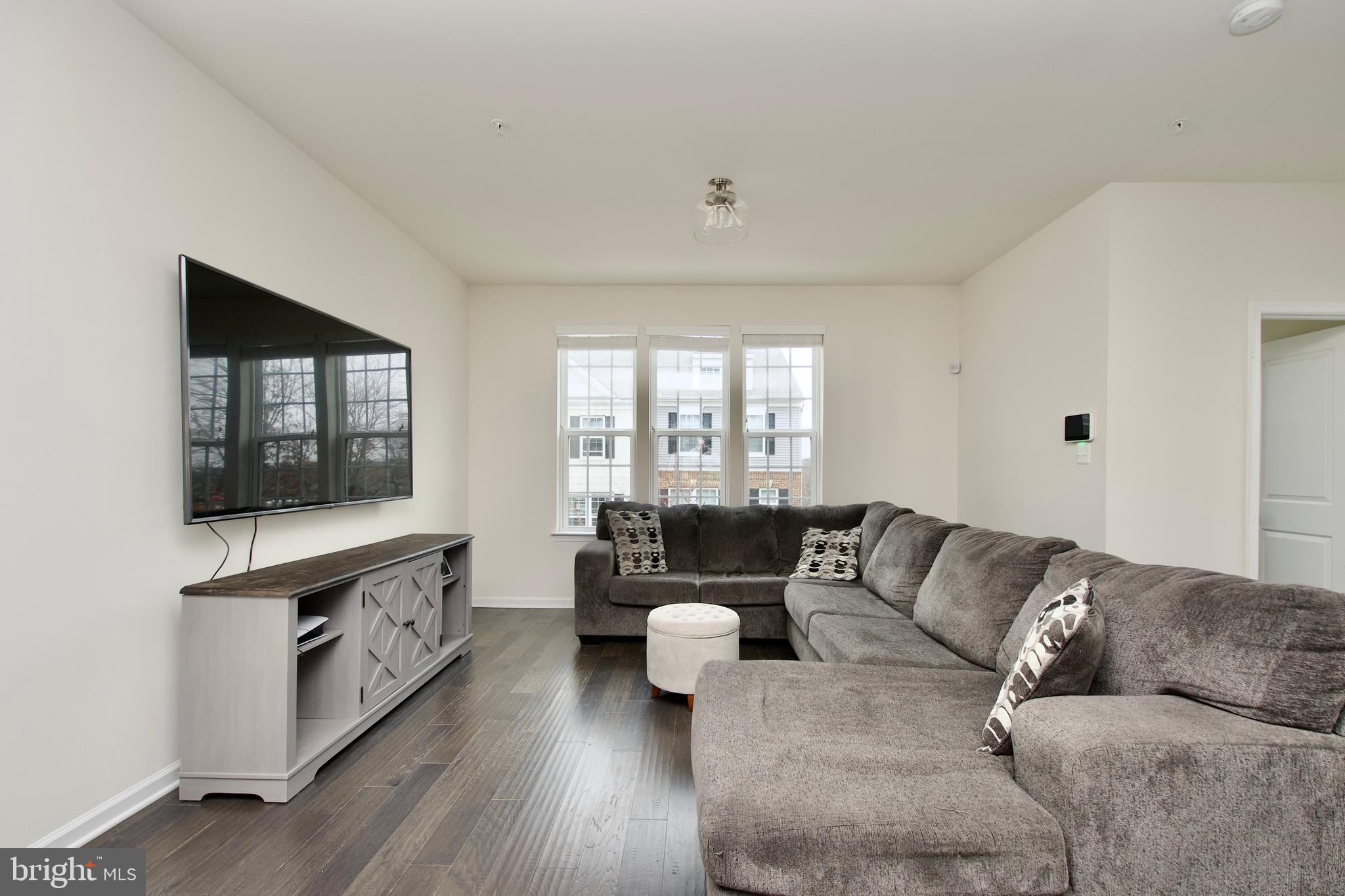2900 Pinebrook Road Landover, MD 20785 - Photo 24 of 46 a living room with furniture and a flat screen tv