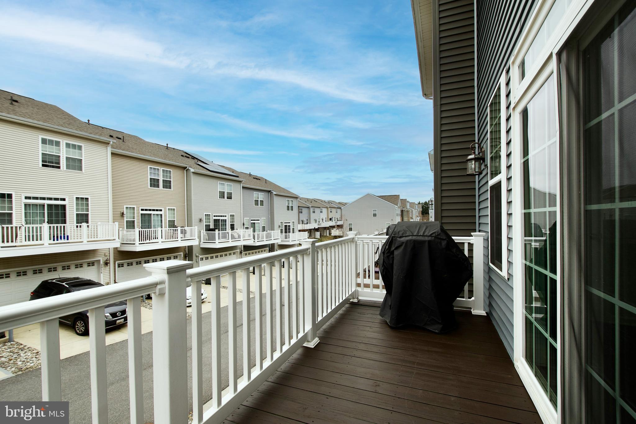 2900 Pinebrook Road Landover, MD 20785 - Photo 25 of 46 a view of a balcony with wooden floor and fence
