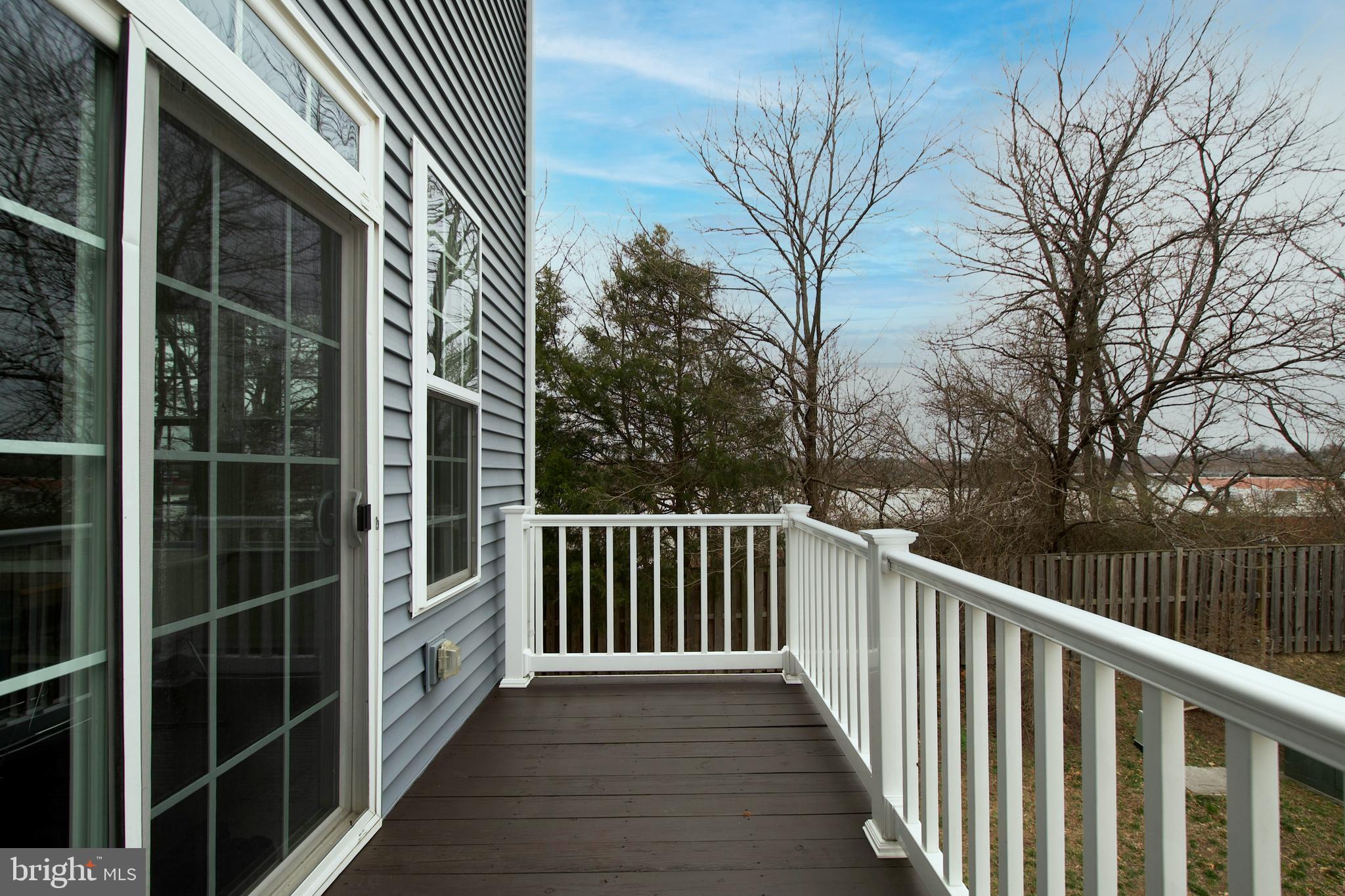 2900 Pinebrook Road Landover, MD 20785 - Photo 26 of 46 a view of a deck with a white house next to a yard