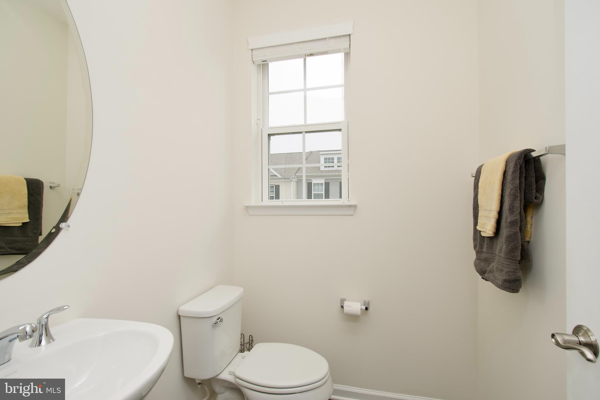 2900 Pinebrook Road Landover, MD 20785 - Photo 27 of 46 a white toilet sitting next to a bathroom sink
