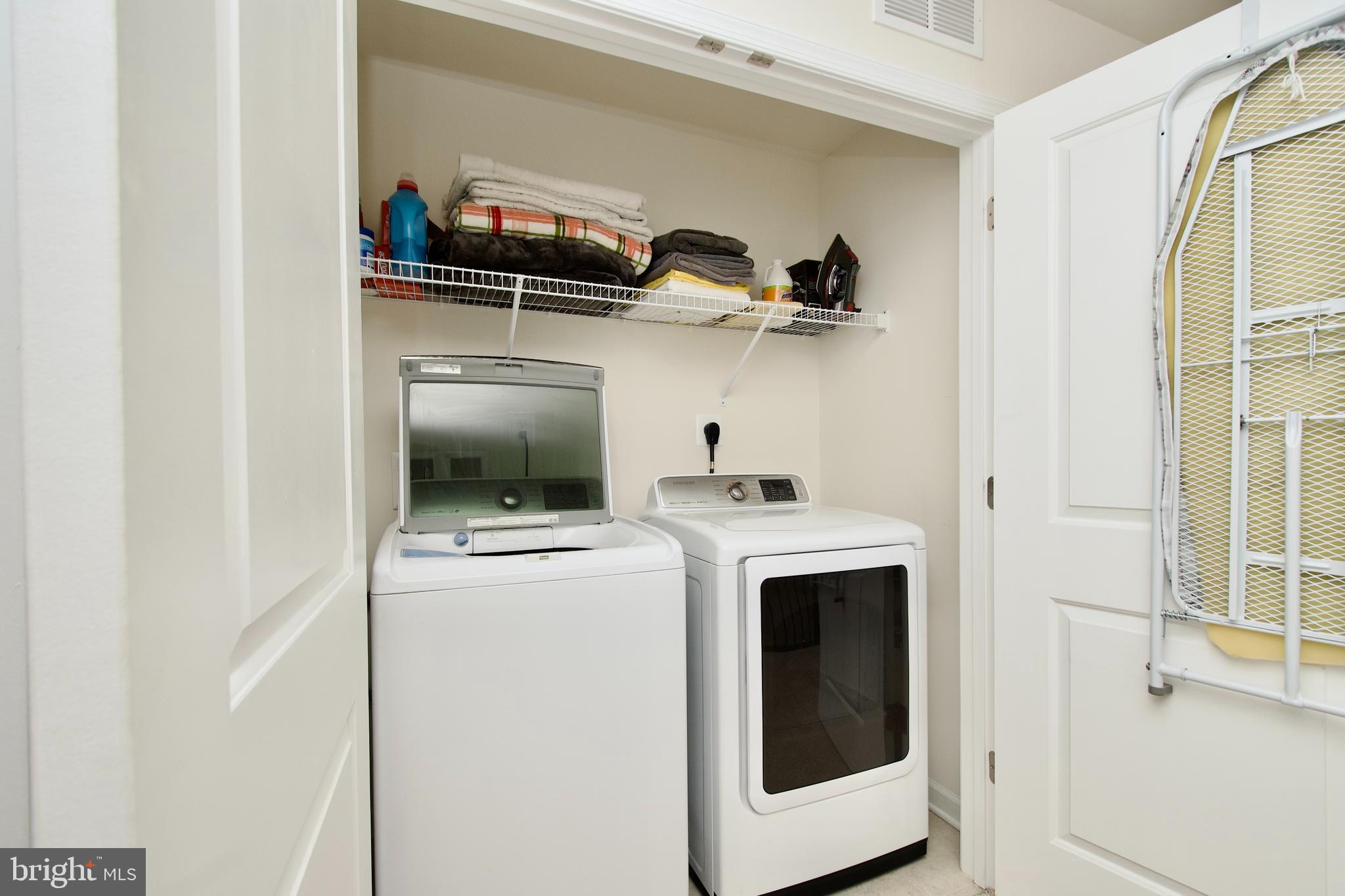 2900 Pinebrook Road Landover, MD 20785 - Photo 29 of 46 a view of storage and utility room with washer and dryer