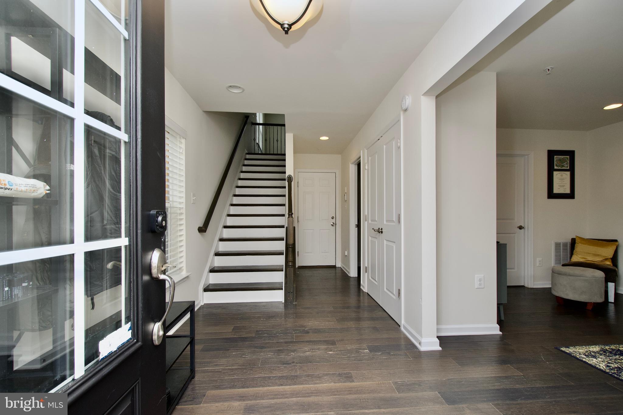 2900 Pinebrook Road Landover, MD 20785 - Photo 3 of 46 a view of a hallway with wooden floor and entryway