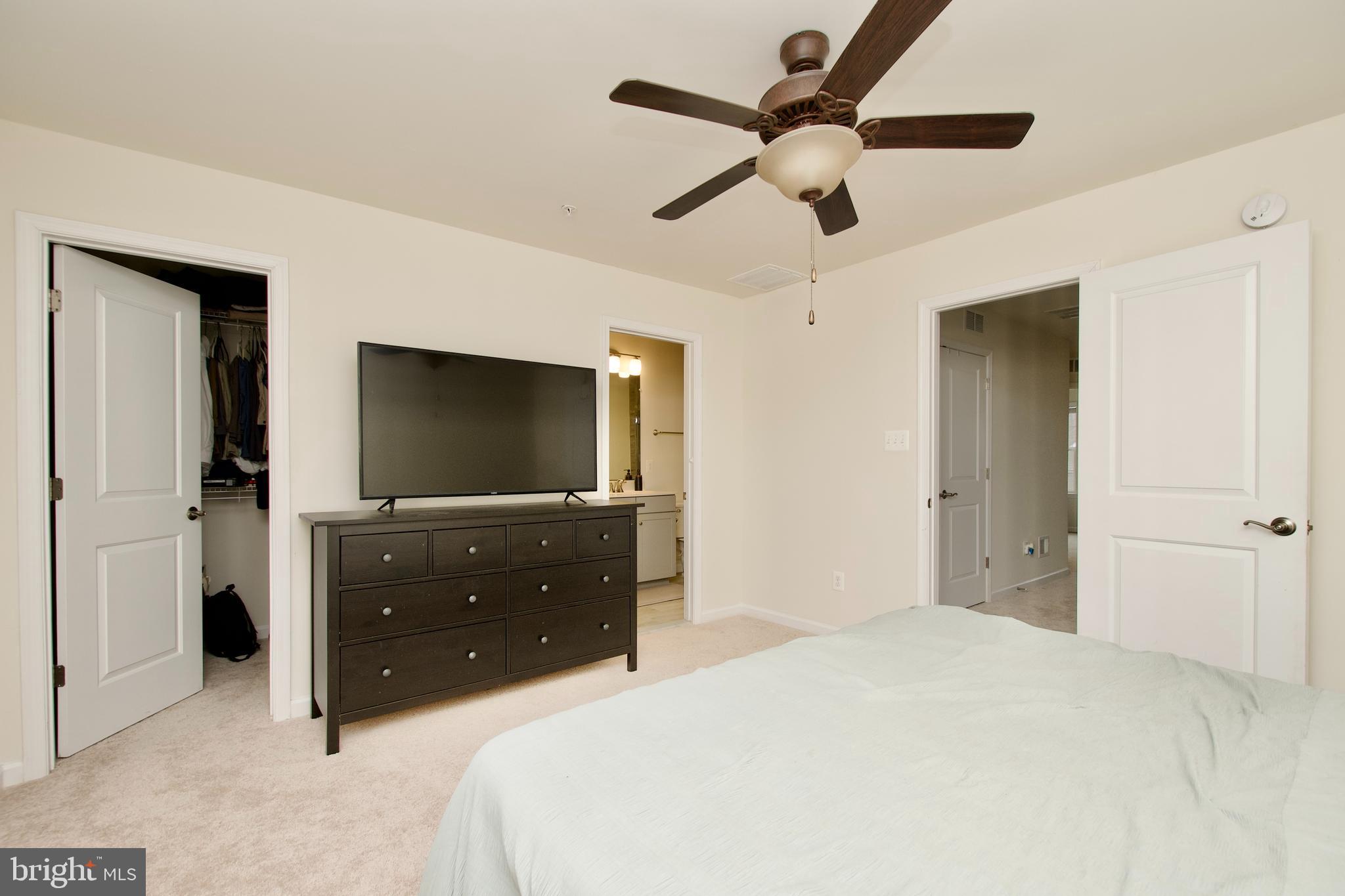 2900 Pinebrook Road Landover, MD 20785 - Photo 31 of 46 a bedroom with a bed and a flat screen tv