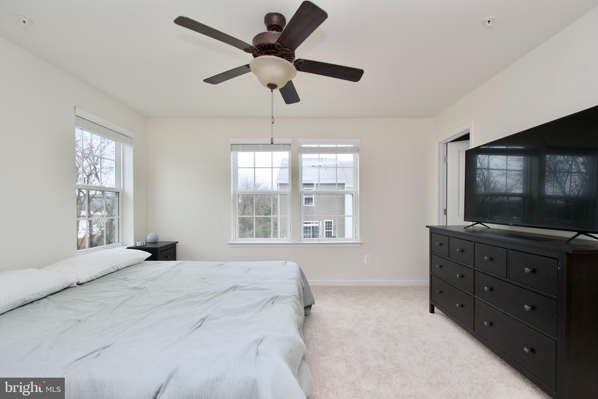 2900 Pinebrook Road Landover, MD 20785 - Photo 32 of 46 a bedroom with a bed and a flat screen tv