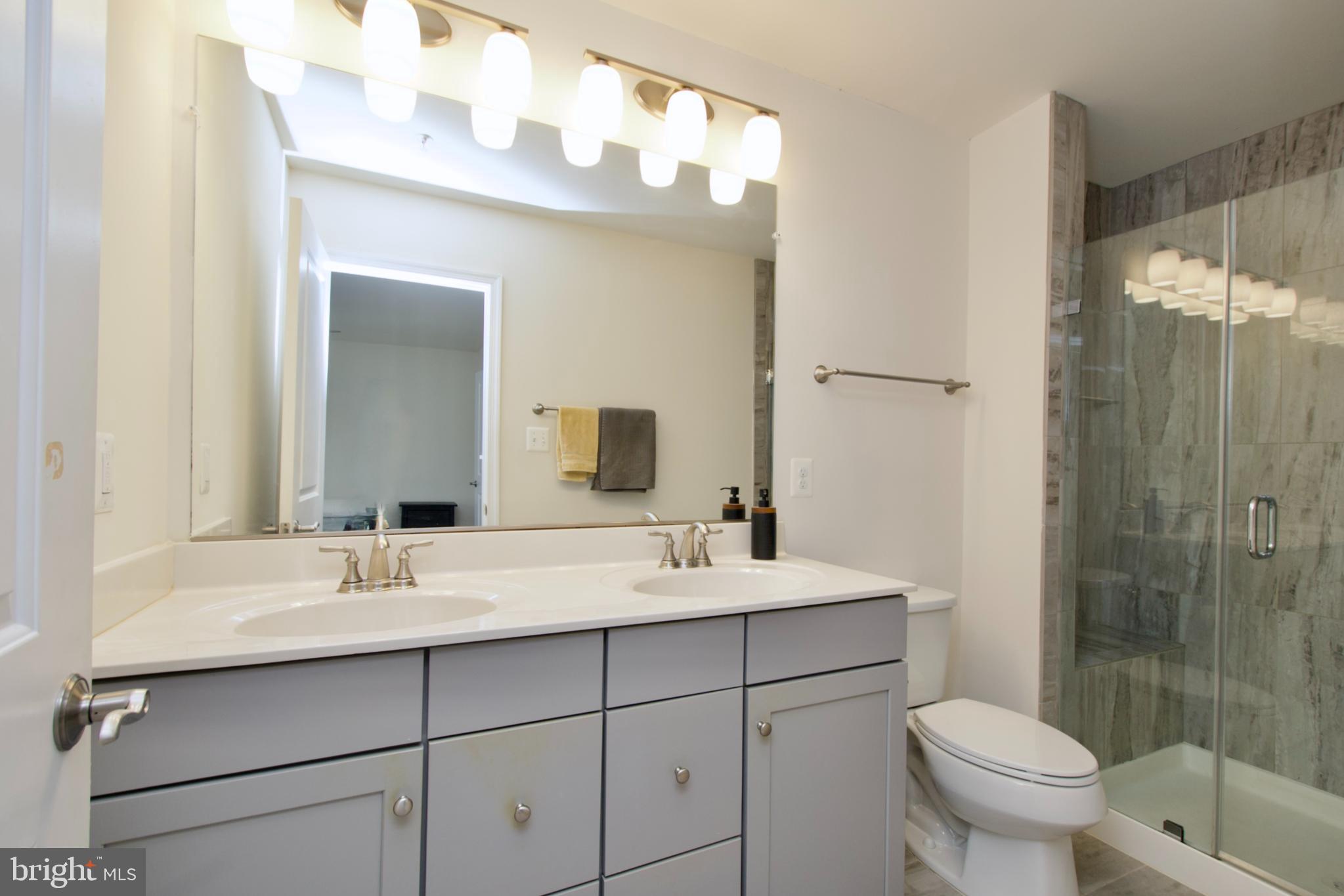 2900 Pinebrook Road Landover, MD 20785 - Photo 33 of 46 a bathroom with a sink toilet and shower