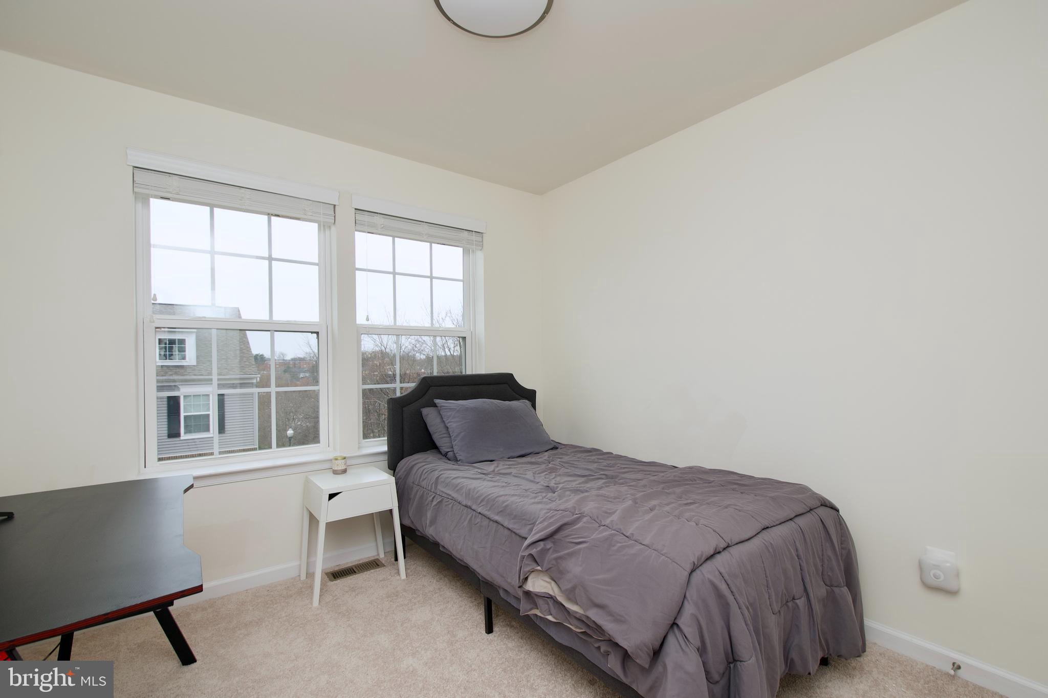 2900 Pinebrook Road Landover, MD 20785 - Photo 35 of 46 a bedroom with a bed and window