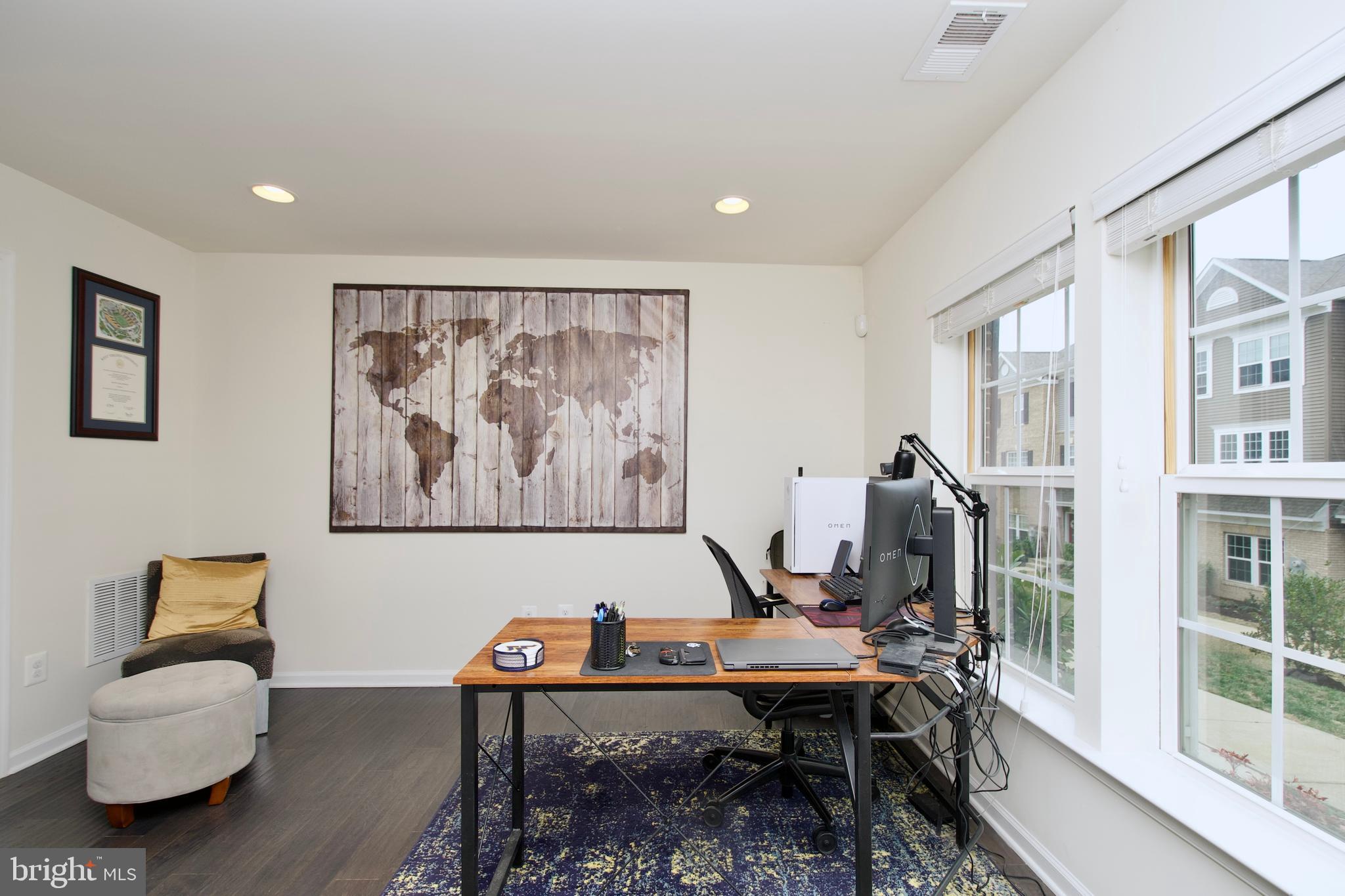 2900 Pinebrook Road Landover, MD 20785 - Photo 6 of 46 a view of a workspace with furniture and a potted plant