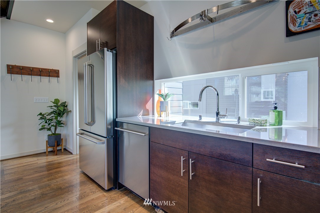 4262 Linden Avenue North Seattle, WA 98103 - Photo 12 of 40 a kitchen with sink and refrigerator