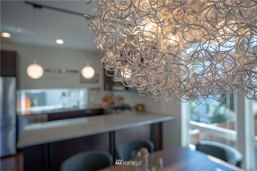 4262 Linden Avenue North Seattle, WA 98103 - Photo 15 of 40 a view of a room with a tree and wooden floor