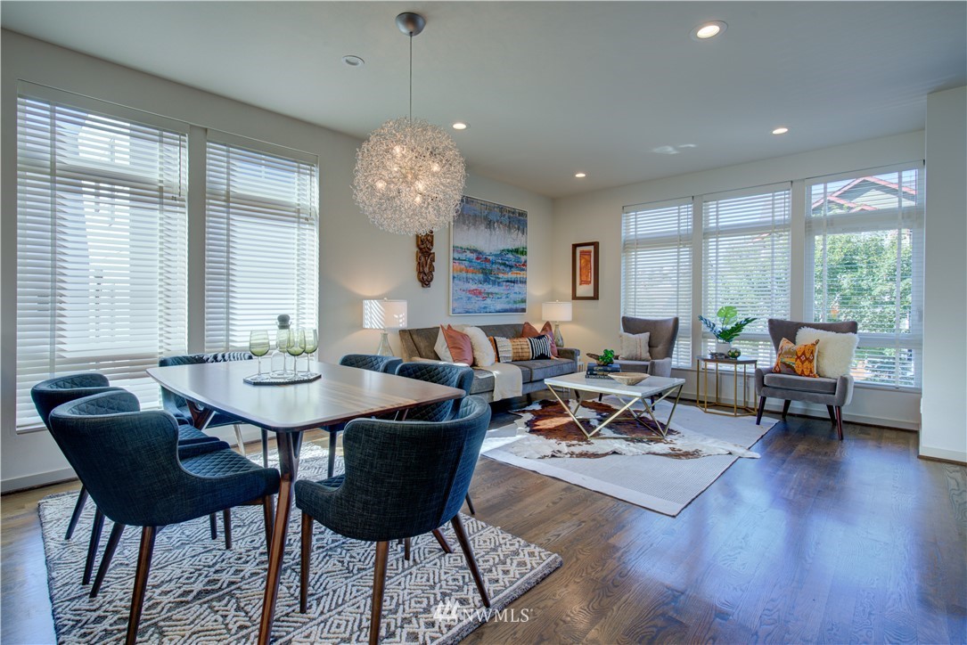 4262 Linden Avenue North Seattle, WA 98103 - Photo 16 of 40 a living room with furniture kitchen view and large windows