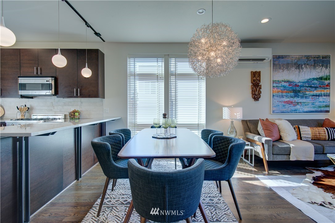4262 Linden Avenue North Seattle, WA 98103 - Photo 17 of 40 a view of a dining room with furniture and chandelier