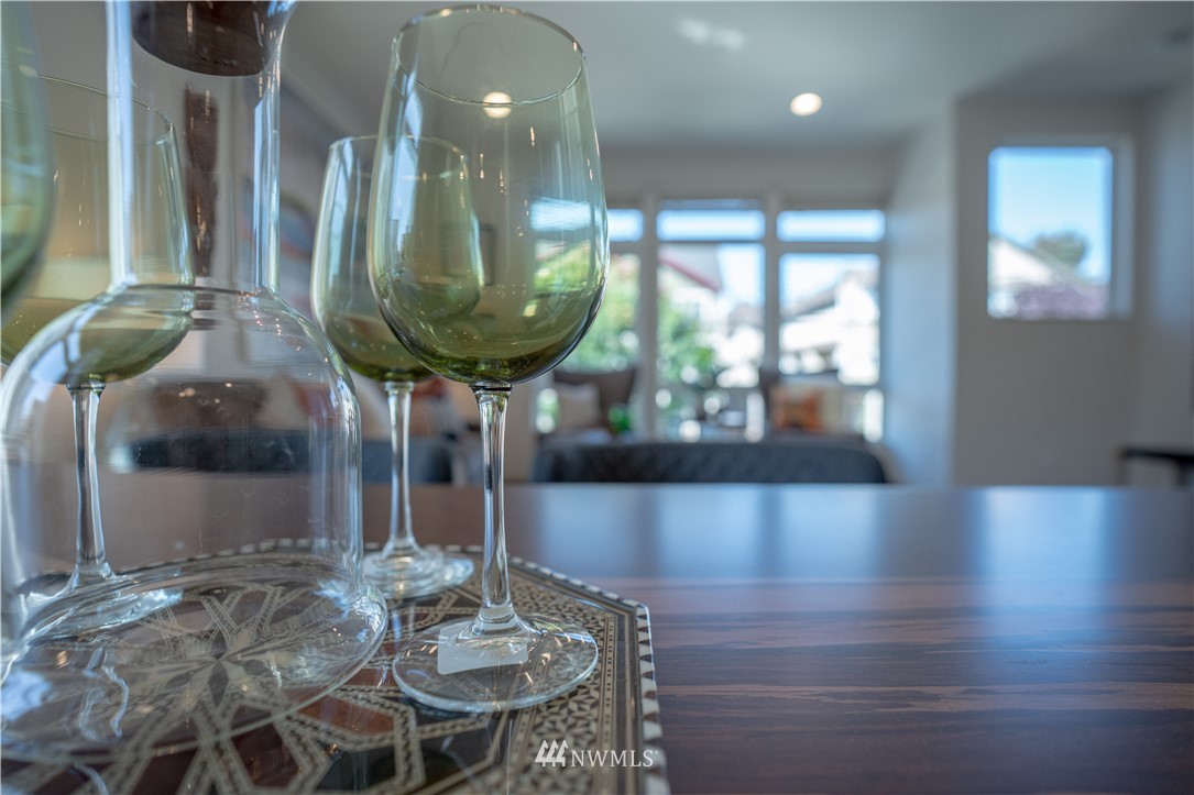 4262 Linden Avenue North Seattle, WA 98103 - Photo 20 of 40 a view of a dining room with furniture and a chandelier