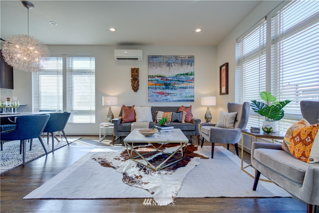 4262 Linden Avenue North Seattle, WA 98103 - Photo 21 of 40 a living room with furniture and a chandelier