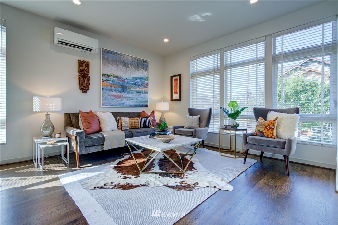 4262 Linden Avenue North Seattle, WA 98103 - Photo 22 of 40 a living room with furniture and wooden floor
