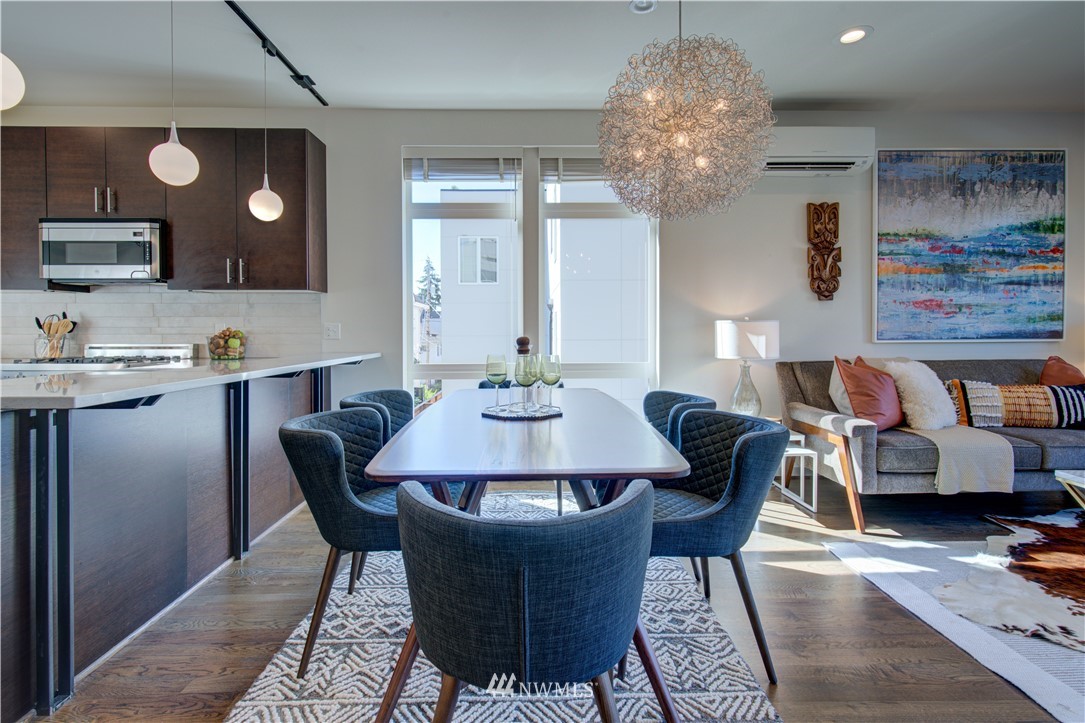 4262 Linden Avenue North Seattle, WA 98103 - Photo 25 of 40 a view of a dining room with furniture and chandelier